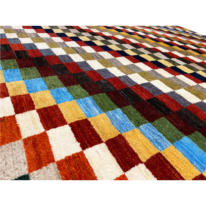 Gabbeh rug detail, dense woven pattern with colorful squares and clear contours.