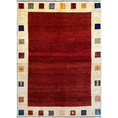 Gabbeh rug with a red center and cream-colored border, geometric squares