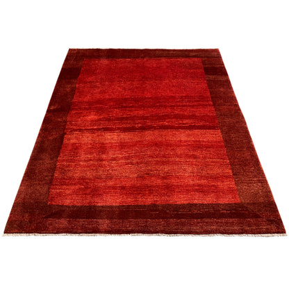 Red Gabbeh rug with a central stripe pattern and wide border edging
