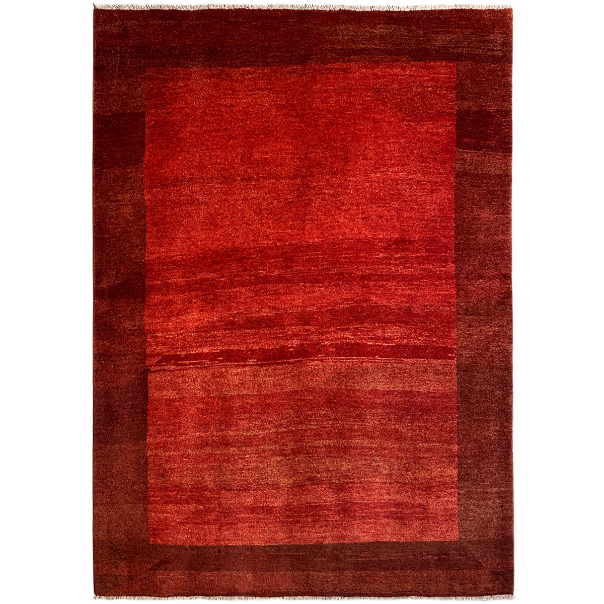 Gabbeh rug in red with a dark border and patterned areas