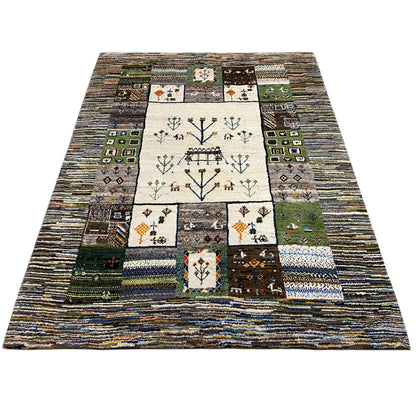 Rectangular Gabbeh rug with a central pictorial field and colorful patchwork squares