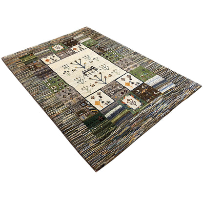 Gabbeh rug in a patchwork design with tree and floral motifs in the center