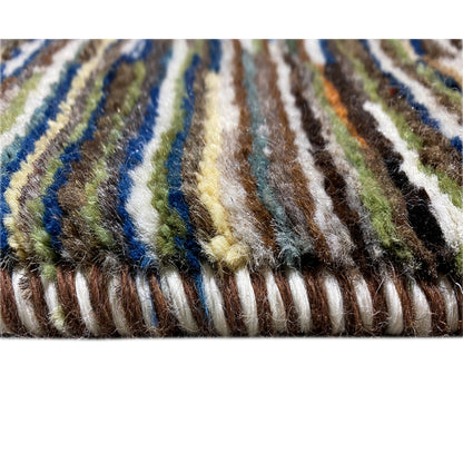 Close-up of the edge: Gabbeh rug with a multicolored, striped fringe area