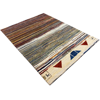 Gabbeh rug appearing rolled up, angled view: colorful stripes and geometric ornaments