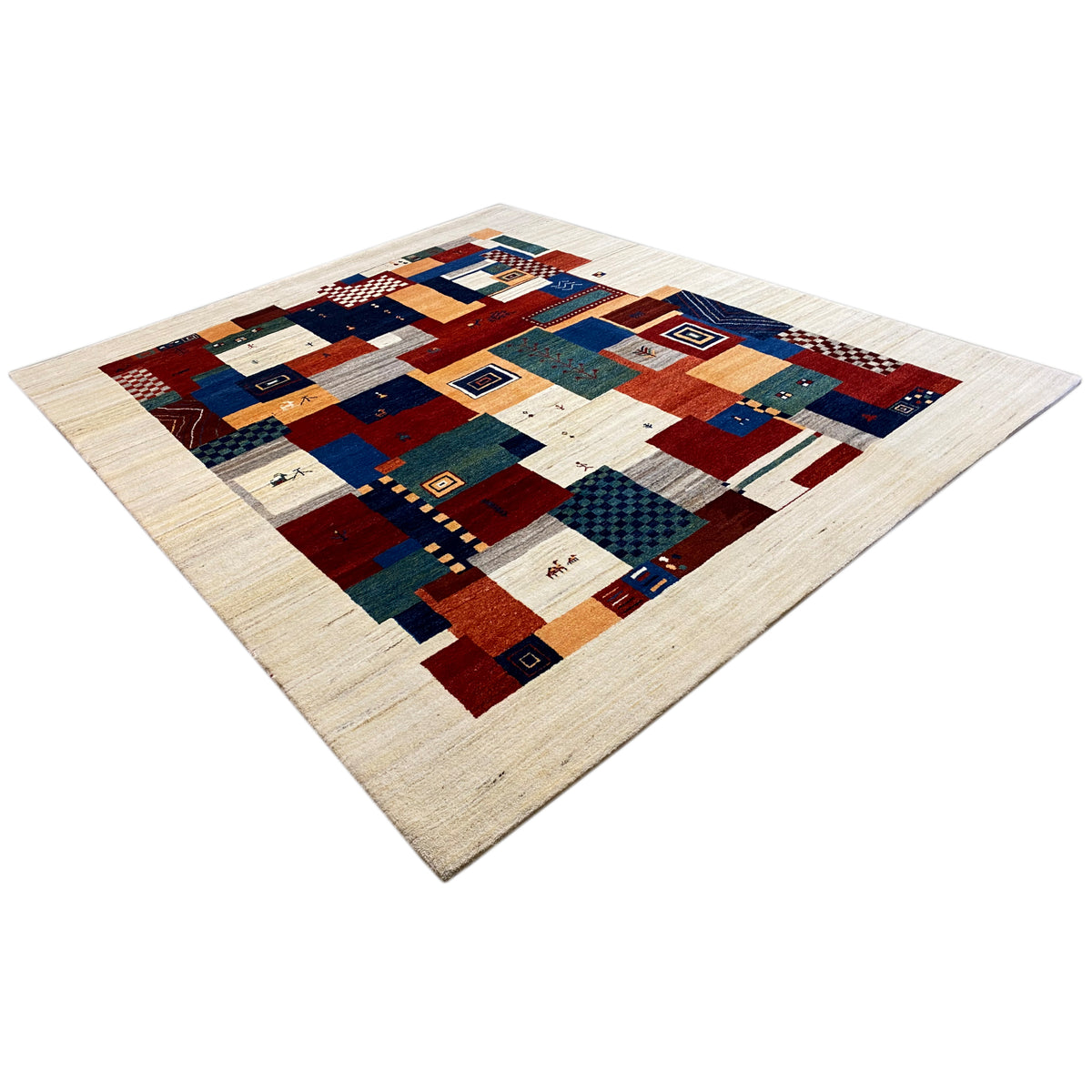 Beige Gabbeh rug with a square patchwork design in blue, red, and green