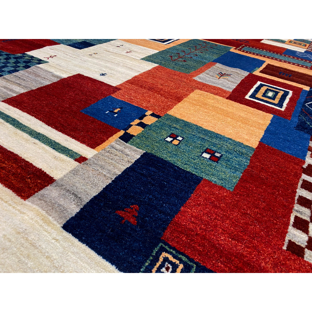 Gabbeh rug close-up: multicolored patchwork with geometric patterns
