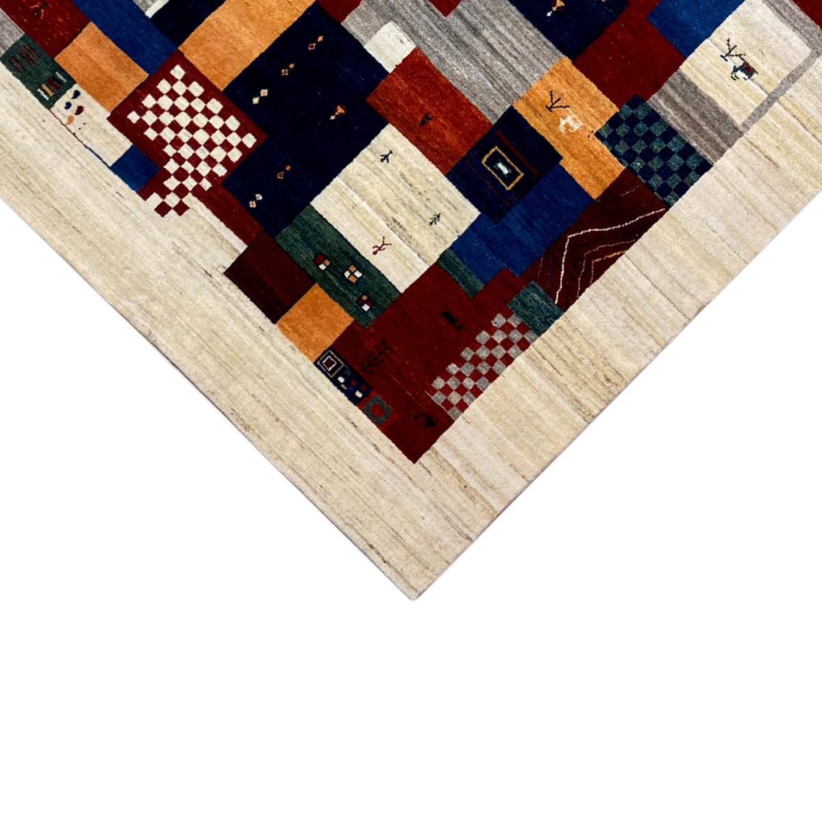 Gabbeh rug corner view: central pattern of geometric patchwork fields