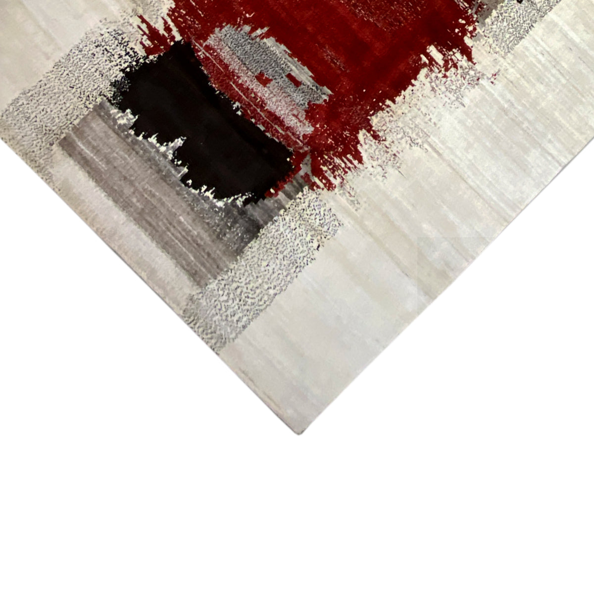 Gabbeh rug corner detail: black square, red area, and gray stippled pattern