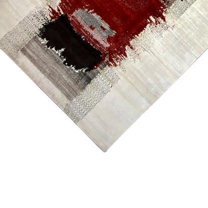 Gabbeh rug corner detail: black square, red area, and gray stippled pattern