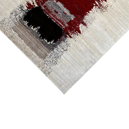 Carpet detail with a red color field, black pattern, and beige background