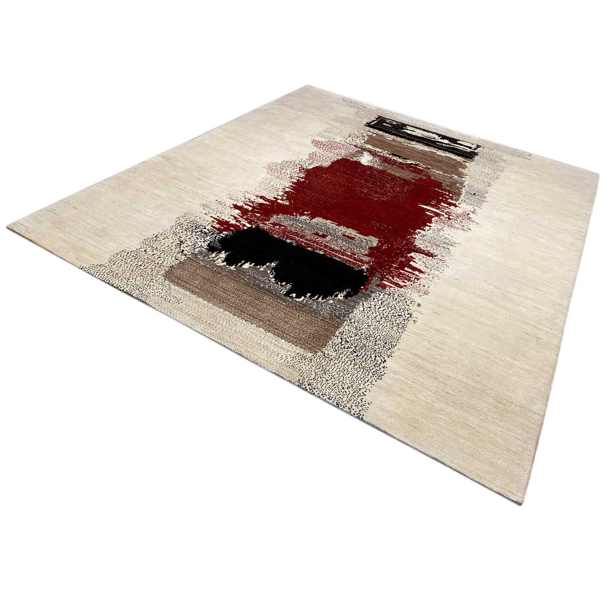 Gabbeh rug shown at an angle: light area with a red section and dark squares
