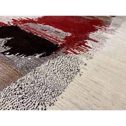 Gabbeh rug close-up: light fiber texture with red, black, and gray sections
