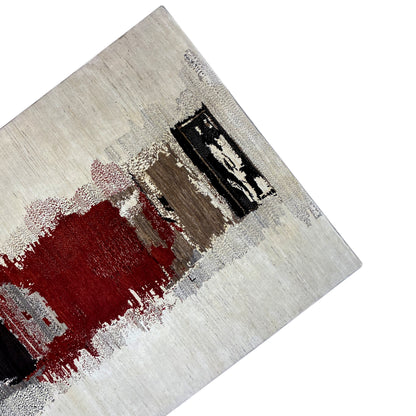 Gabbeh rug detail: red field, black accents, and gray flecks on beige