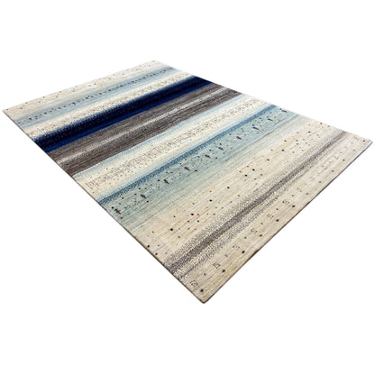 Gabbeh rug in cream and blue with a diagonal view and fine patterned stripe effect