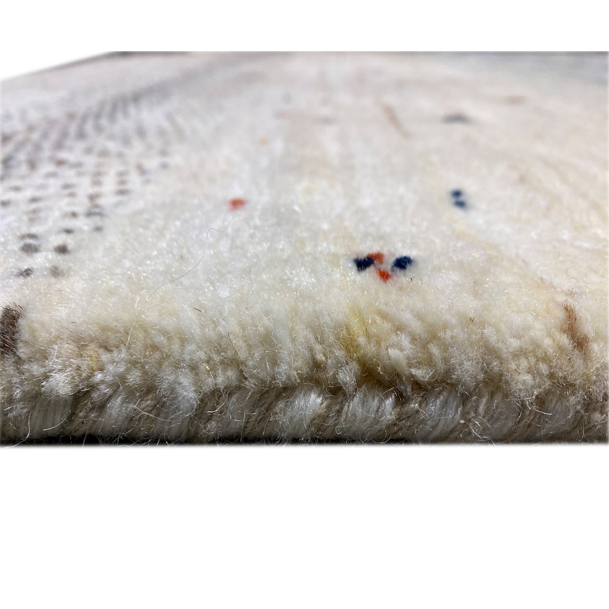 Carpet backing with a short pile and small colored inclusions, light beige
