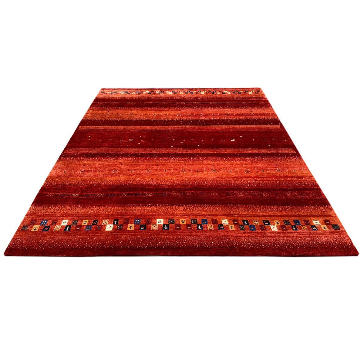Red Gabbeh rug at an angle, with a striped pattern and a surrounding border