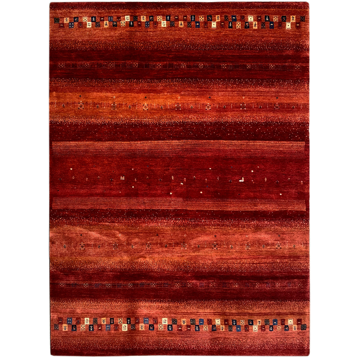 Red Gabbeh rug with wide stripes and colorful diamonds along the edges