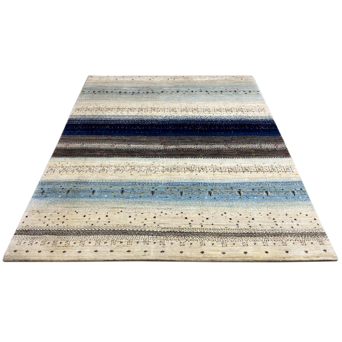 Rug in cream, blue and dark gray with wide stripes and fine flecks of color