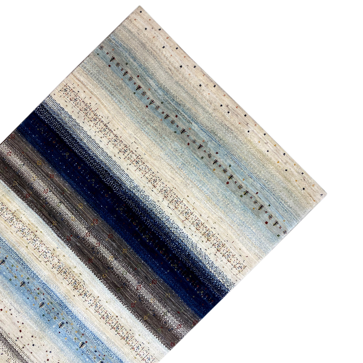 Rug viewed from above: light cream and pale blue stripes, with dark band patterns in between