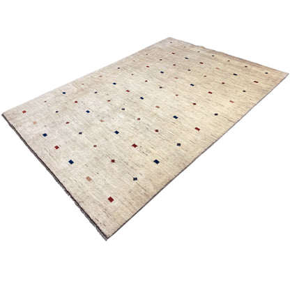 Gabbeh rug with a light beige background, scattered colorful squares, and a fine texture