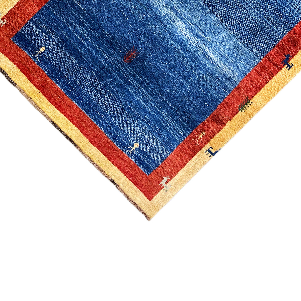 Rug with a blue field, red border, and beige edge, small dot motifs