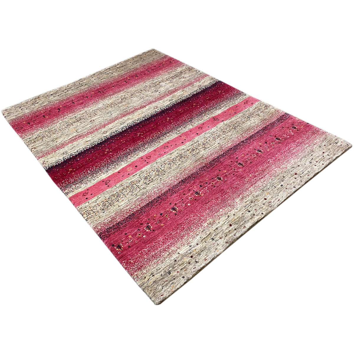 Gabbeh rug laid diagonally, beige pile with red stripes and glints