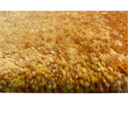 Carpet fiber detail: dense pile in warm ochre with visible texture