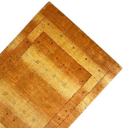 Top view of a rug: ochre border and central square with subtle patterns