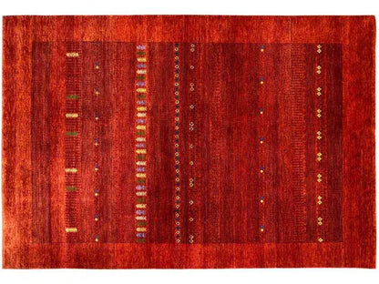 Gabbeh rug laid flat: red background with vertical bands and multicolored dots