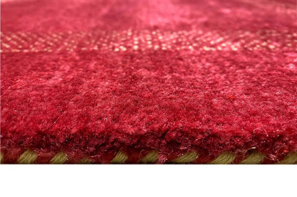Lori gabbeh rug with red pile and a visible fringed border