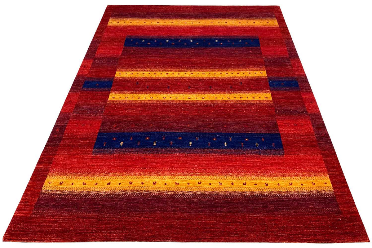 Gabbeh rug, striped pattern in red, yellow, and blue, triangular perspective