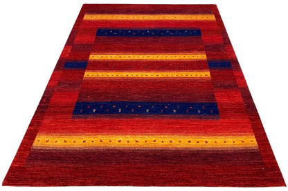 Gabbeh rug, striped pattern in red, yellow, and blue, triangular perspective