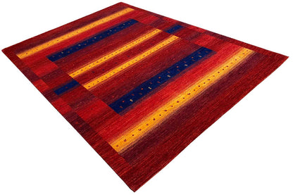 Gabbeh rug with a diamond pattern, red fields with yellow and blue stripes