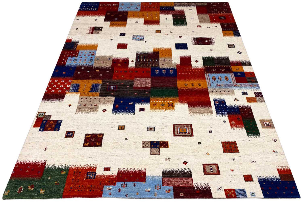 Gabbeh rug (top view) with square color blocks and small ornaments on a light background