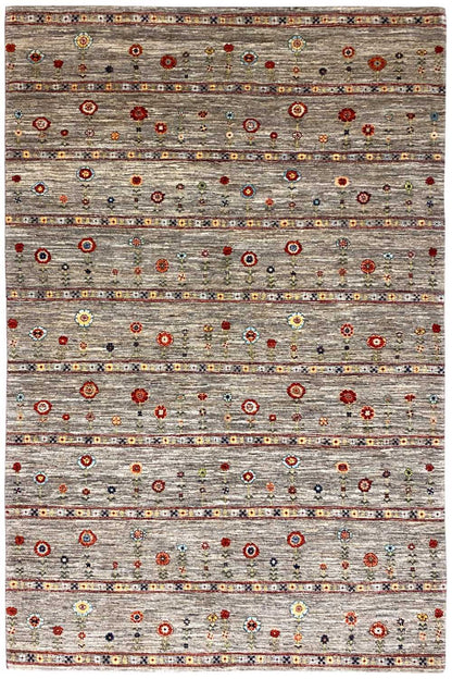 Gabbeh rug with a gray base and colorful circular and floral patterns