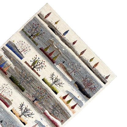 Gabbeh rug, diagonal view: striped pattern with tent and tree motifs