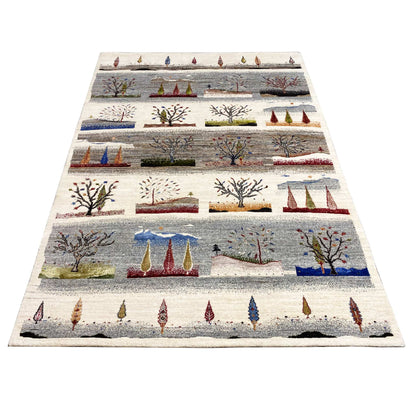 Gabbeh rug lying flat, full view with tree and tent motifs
