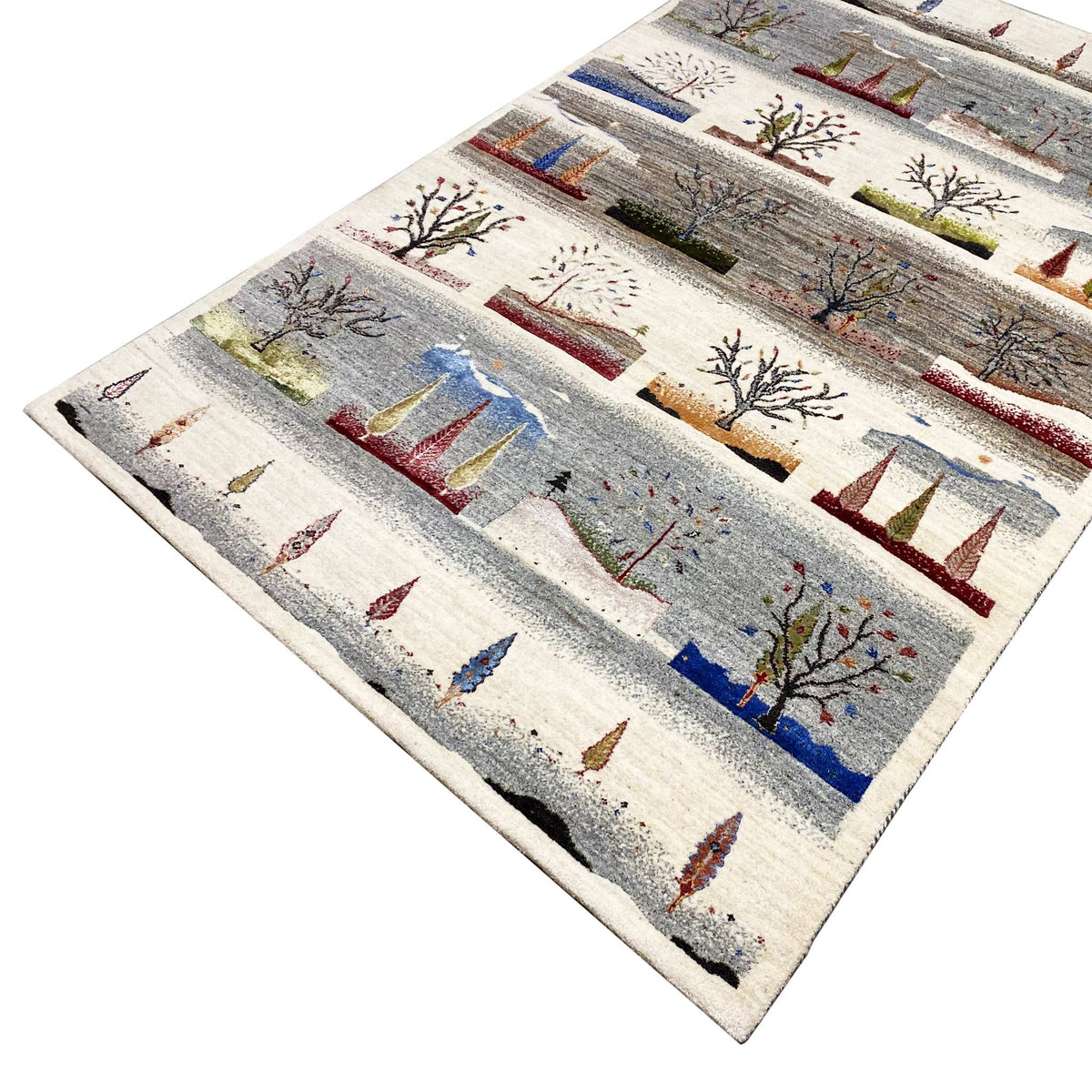 Gabbeh rug from an oblique perspective: recurring tree and tent motifs