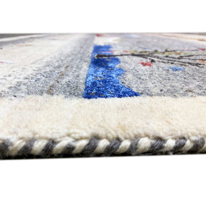Gabbeh rug detail at the edge: short pile and braided fringe on a light background