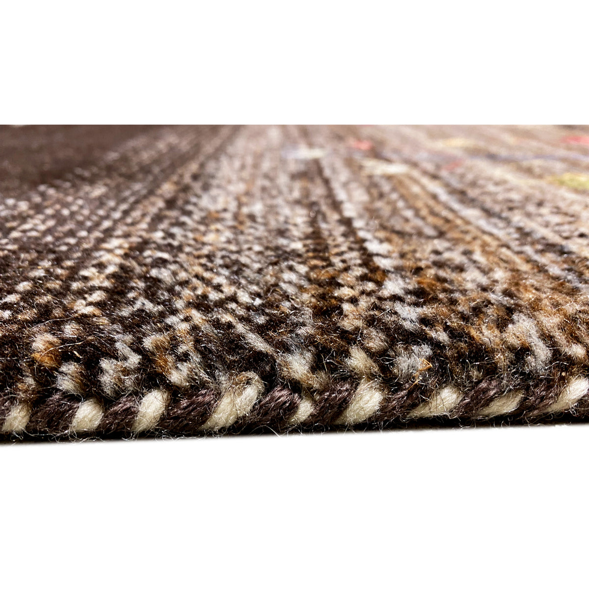 Gabbeh rug close-up of the pile texture: dark brown and natural beige.