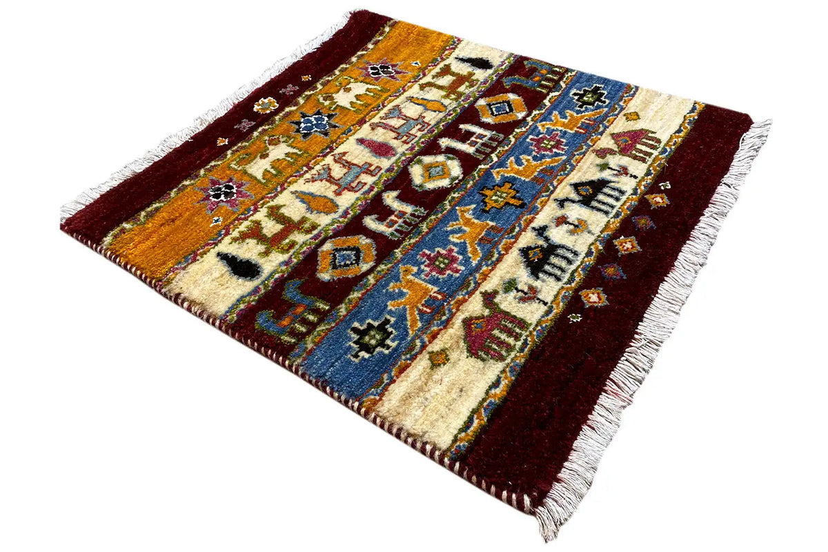 Gabbeh rug 63x58 cm, square, cream and blue with a reddish-brown border and fringes.