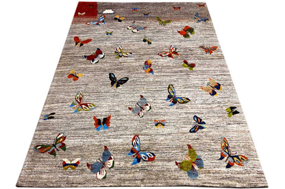 Gabbeh rug, spread out, light gray with colorful butterflies