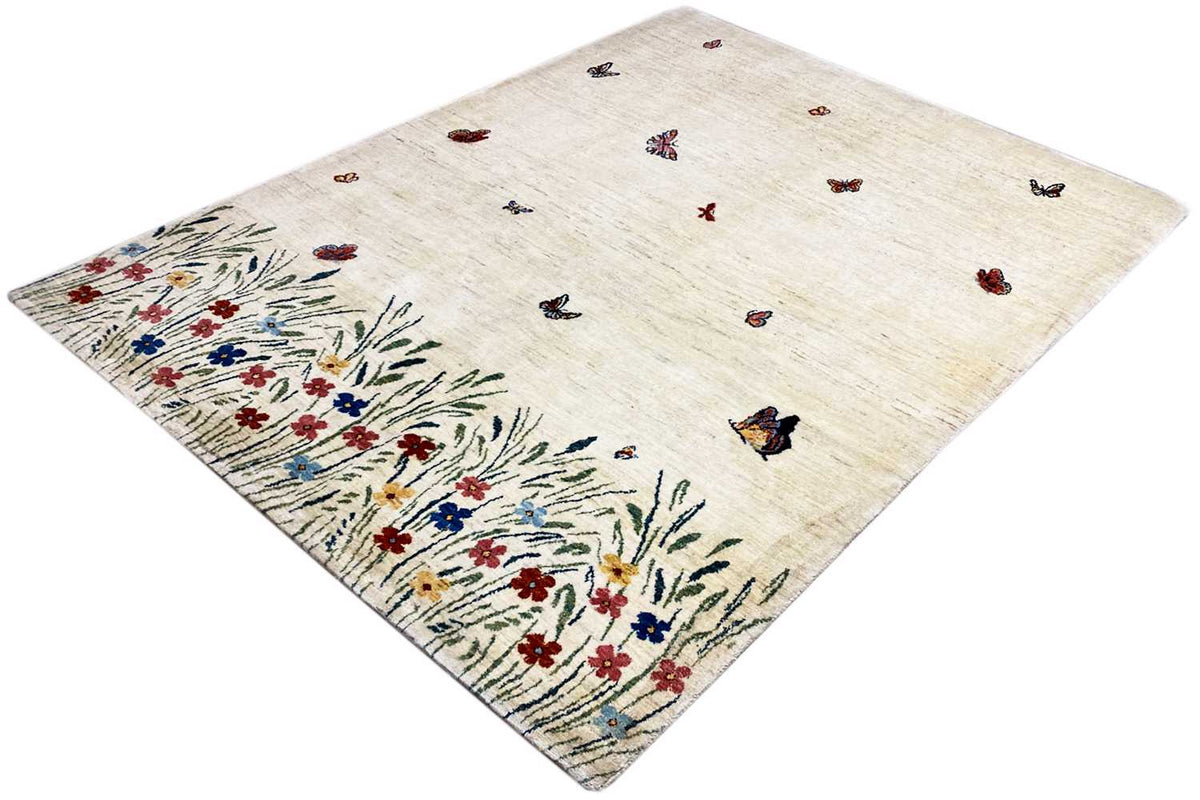 Gabbeh Lori rug: beige rug with butterflies and a dense floral and botanical border pattern
