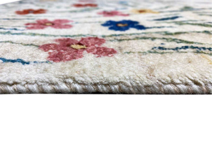 Gabbeh-Lori rug: Detail of the selvedge with a multicolored floral pattern, dense pile