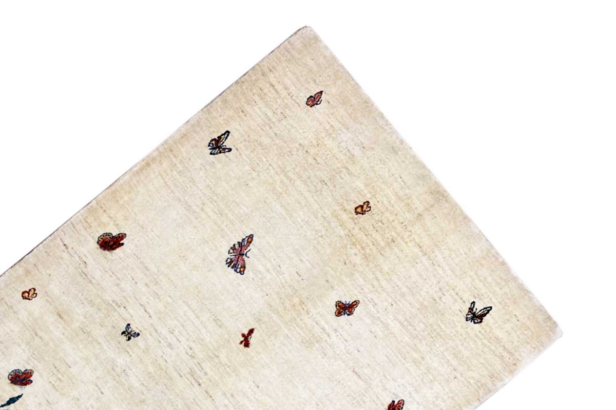 Gabbeh Lori rug: beige rug with scattered butterflies, rounded edge