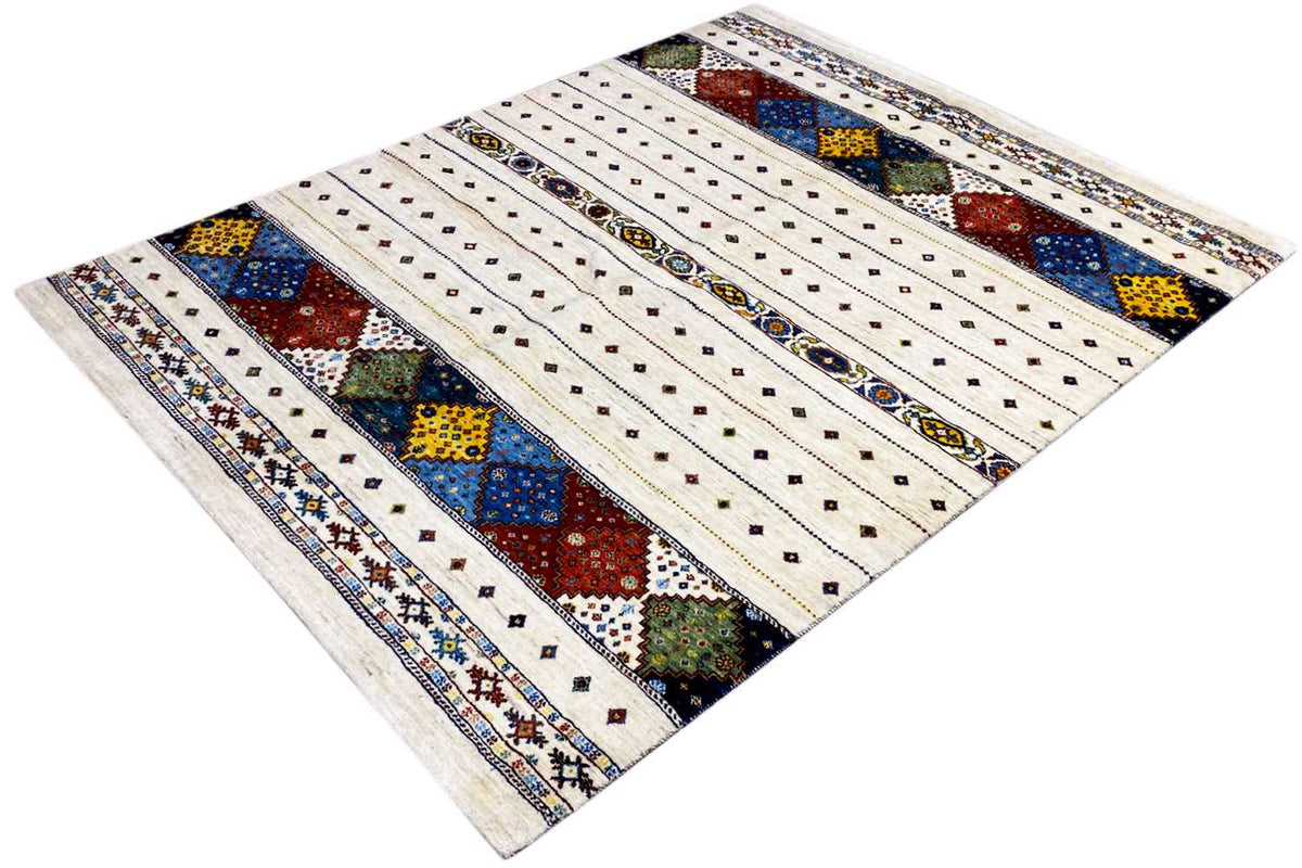 Carpet diagonally, cream-colored background with multicolored diamonds and lines