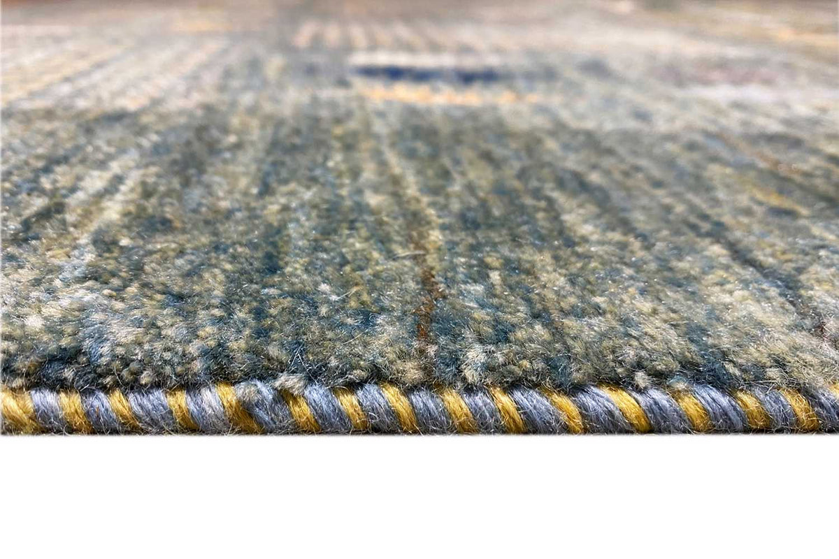 Close-up: Gabbeh Lori rug edge with a multicolored woven pattern and low pile