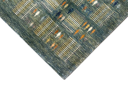 Gabbeh Lori rug detail: geometric squares in blue-gray with orange lines