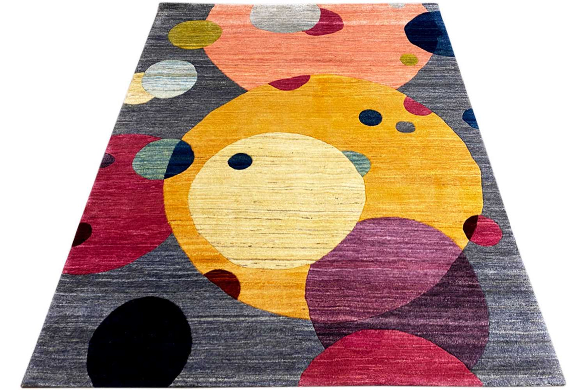 Gabbeh rug, abstract design with a yellow animal shape and colorful patches on dark gray