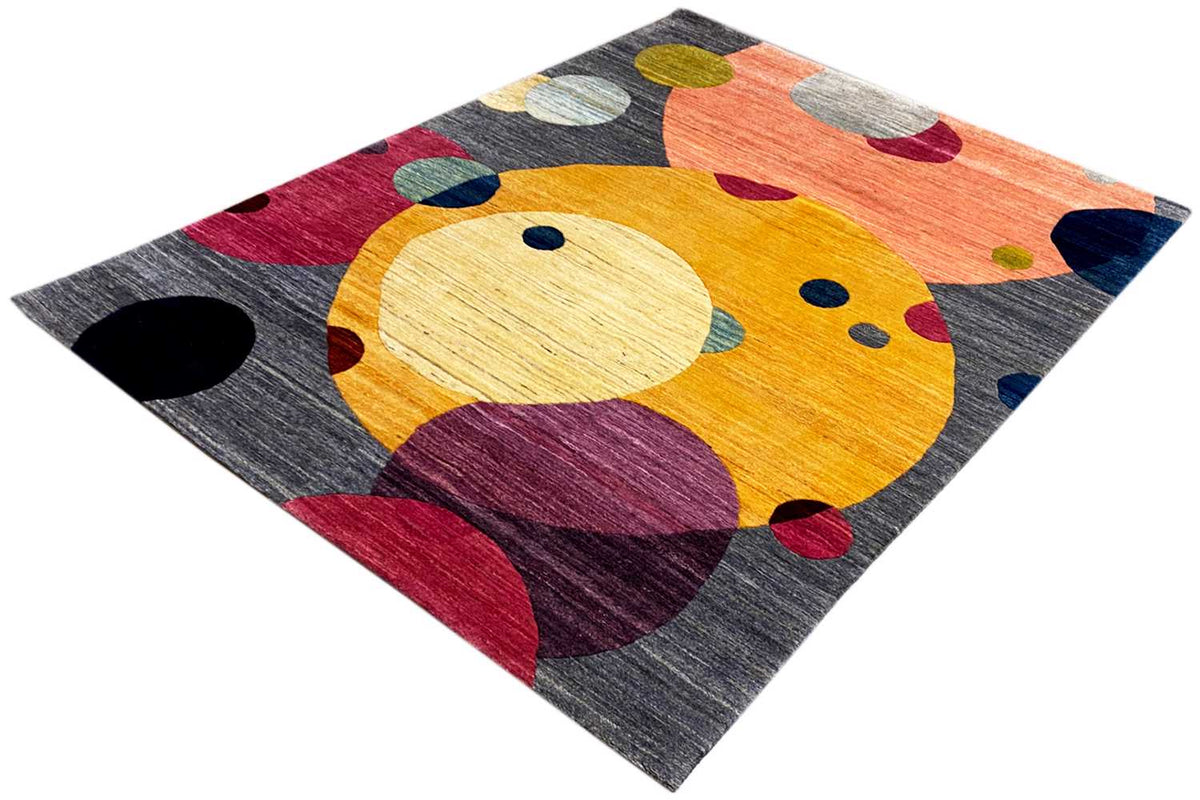 Gabbeh rug in three-quarter view, abstract animal form in yellow with violet and red areas